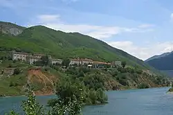 Settlement of Fierzë, on the Tropojë side, with the dam at right