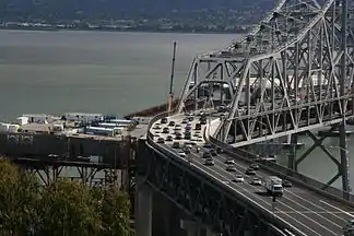 April 20, 2010: At the S-connector the remainder of original section is now dismantled and the main span counterweight is in place. Main span sections are being placed upon the falsework truss structure.