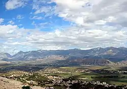 The highlands of Delvinë and the hill of Finiq, ancient Phoinike, in the center of the picture behind the plains.