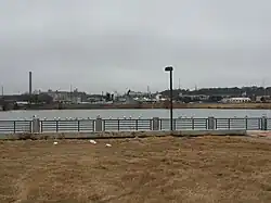 Fish Trap Lake Park in West Dallas, including the smokestack of the defunct RSR Corporation smelter in the background