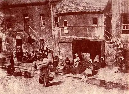 Fishwives in St Andrews, Scotland bait their lines