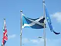 The Flag of the United Kingdom, Flag of Scotland and Flag of Europe at the Scottish Parliament Building.