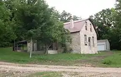 An old flagstone building at Longrun