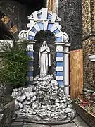 The shrine at the entrance to the church for Our Lady of Lourdes