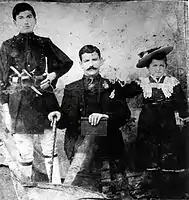 Evangelos Natsis (center), his daughter (right), and an unknown individual (left).