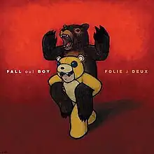 A drawing of a young boy, dressed in a bear costume holding a bear in his hands on a red background. The band name and album title are written in between.