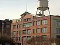 Close-up view of the back of the plant; Ponce City Market (formerly the Sears building, then City Hall East) in background