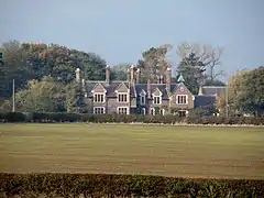 New crop emerging near Thorpe Constantine. The former Rectory beyond is believed to date from the 1820s