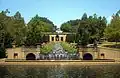 Photograph of the Italian-renaissance stairstep fountain at Meridian Hill Park, bordered by vegetation.