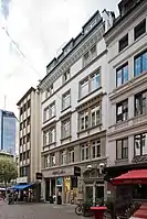 Kaiserhofstraße 5, at the corner of Freßgass. Built 1875 in the late Classicist style. The building is under cultural heritage protection. The Main Tower in the background.