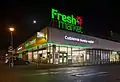 A Freshmarket store at night