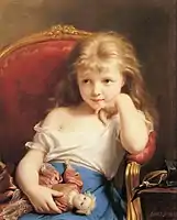 Young girl holding a doll