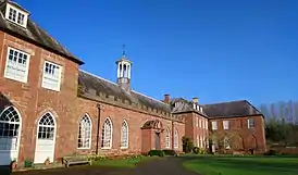 Angled photograph showing the front exterior of the Castle in the sunshine.