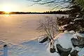 The sun rises above a frozen Lake Echo in 2007