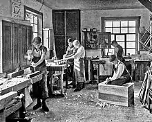 Image 9Students in a carpentry trade school learning woodworking skills, c. 1920 (from Vocational school)