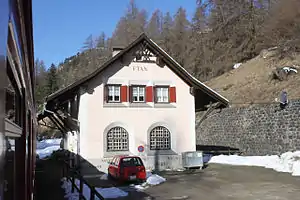 Two-story building with gabled roof