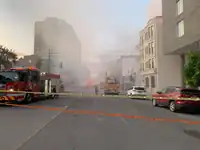 Photo of the extent of the smoke on rue Sherbrooke five hours after the start of the May 25, 2023, fire.