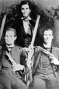 Kirk with his father Alexander (standing) and brother John (seated left)