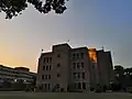 The eastern facade of the library building during an evening