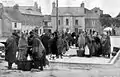 Women wearing Galway shawls at Galway Fish Market, Ireland. 1905