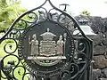 Gate with royal crest at Huilihe'e Palace. (10/2012)