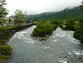 Viewed from the bridge of the D921 road, the Gave de Gavarnie marks the boundary between Soulom hydroelectric power station to the left and centre, and Villelongue on the right