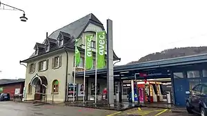 Three-story building with gabled roof