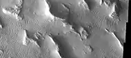 Gigas Sulci, as seen by THEMIS. Wavy linear ridges are dunes.  Dark slope streaks are visible on some slopes if you click on image for larger view.