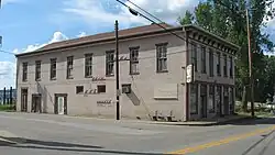 Ginn's Furniture Store with high water marks on exterior wall