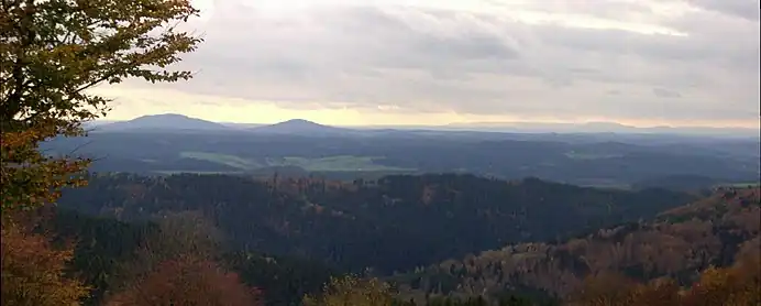 View from the Simmersberg ({{Subst:Formatnum:781}} m) in the Thuringian Highland of the Gleichberge, 24 km away. Right rear: the Rhön and the Kreuzberg ({{Subst:Formatnum:927.8}} m), 67 km away. Centre, half right: the Ratscher Bergsee lake, 7 km away