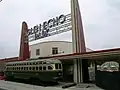 A PCC streetcar at the renovated Streamline Moderne entrance to Glen Echo Park (June 2006)