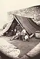 Homeless survivors of the earthquake of Messina, in 1908, under a tent.