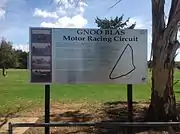 A sign commemorating the Gnoo Blas circuit at its former location.