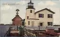 Postcard c. 1905 of the Newport Harbor Light with the 1864 keeper's house still attached