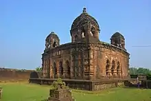 Gokulnagar: Gokulchand Temple - Monument of National Importance Pancha ratna, laterite built in the 17th century, with stucco figures.