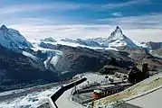 Matterhorn (far before), viewed from Gornergrat railway station and, from left to right, Klein Matterhorn, Breithorn, the nowadays disconnected Lower Theodul Glacier, Upper Theodul Glacier (June 2006).