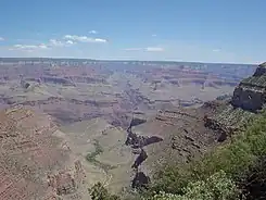 (view due-north, northeast, from Bright Angel Trail, (South Rim section) – View of south-draining Bright Angel Canyon, containing in its lowest section with the Tapeats Sandstone, upon the Granite Gorge, the cliffs of gray-brown Muav Limestone (25% at base of Redwall Limestone), laid upon the slope-forming & greenish Bright Angel Shale. (The trail also descends/ascends through units on the South Rim, at near photo view.)