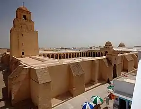 Stone building with tower and courtyard (from Human history)