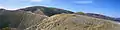 The Great Alpine Road winds across Mount Hotham, clinging to the side and ridge of the mountain