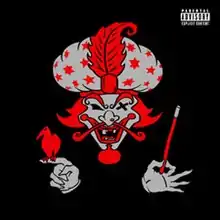 Objects, two disembodied hands, and a disembodied head which has red hair, all on a black background. "The Great Milenko" was released in four colors: red, green (approximately #8AFF3A), purple, and gold; this is the red version where the red is #EB0208.