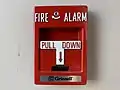 A Grinnell-branded fire alarm pull station