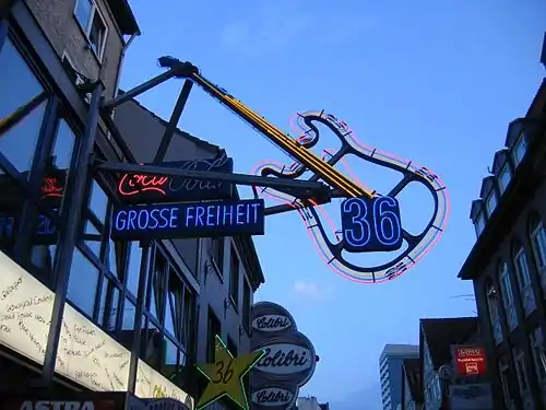 The neon guitar sign over the main entrance