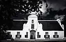 Main house from the front in black and white.