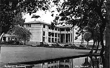 old cars and government building