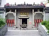 Image 3A Mazu temple in Shek Pai Wan; It clearly shows traits of classical Lingnan style - pale colour, rectangular structures, use of reliefs, among others. (from Culture of Hong Kong)