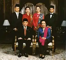 Image 38Formal family portrait of former Indonesian's President B.J. Habibie. Women wear kain batik and kebaya with selendang (sash), while men wear jas and dasi (western suit with tie) with peci cap. (from Culture of Indonesia)