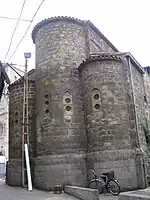 Photograph of a brick building on a city street.