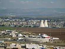 Image 8The oil refinery in Haifa, Israel, is capable of processing about 9 million tons (66 million barrels) of crude oil a year.  Its two cooling towers are landmarks of the city's skyline. (from Oil refinery)