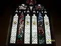 A close up of the stained glass library window