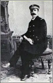 Killick, in uniform, seated